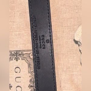 black leather double g Gucci belt .
